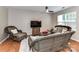 Inviting living room featuring cozy seating, a ceiling fan, and wood-look flooring at 9530 Elizabeth Townes Ln, Charlotte, NC 28277