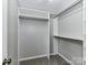 Well-organized walk-in closet with multiple shelving units and hanging rods at 9530 Elizabeth Townes Ln, Charlotte, NC 28277