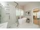 Bathroom featuring a modern soaking tub and walk-in shower at 9920 White Cascade Dr, Charlotte, NC 28269