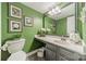 Stylish powder room boasts a sleek vanity, modern lighting, and fresh green walls at 9920 White Cascade Dr, Charlotte, NC 28269