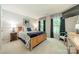 Comfortable bedroom featuring a wooden bed frame, blue floral bedding, and natural light from the windows at 9920 White Cascade Dr, Charlotte, NC 28269