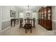Traditional dining room with elegant chandelier, large windows, and classic furnishings, ideal for formal gatherings at 9920 White Cascade Dr, Charlotte, NC 28269