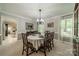 Traditional dining room with elegant chandelier, large windows, and classic furnishings, perfect for entertaining at 9920 White Cascade Dr, Charlotte, NC 28269