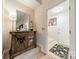 Inviting entryway features a stylish cabinet, mirror, and view to the front door at 9920 White Cascade Dr, Charlotte, NC 28269