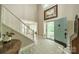 Welcoming foyer features tiled flooring, a staircase, and view to the bright living spaces at 9920 White Cascade Dr, Charlotte, NC 28269
