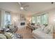 Bright living room features a white brick fireplace, bay window, and comfortable seating at 9920 White Cascade Dr, Charlotte, NC 28269