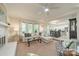 Open concept living room with fireplace, bay window, and clear views to the dining area at 9920 White Cascade Dr, Charlotte, NC 28269