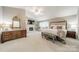 Spacious main bedroom with a fireplace, vaulted ceilings, and a luxurious bed set at 9920 White Cascade Dr, Charlotte, NC 28269