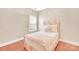 Cozy bedroom features natural light from a window and beautiful hardwood flooring at 1006 Phar Lap Dr, Indian Trail, NC 28079