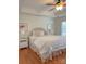 Bright bedroom features tray ceiling, floral accents, and natural light from the window at 1006 Phar Lap Dr, Indian Trail, NC 28079