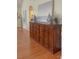 Hallway features a dark wood sideboard with decorative jars and a painting above it at 1006 Phar Lap Dr, Indian Trail, NC 28079