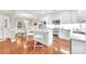 Open-concept kitchen with stainless steel appliances, large island, and hardwood flooring at 1006 Phar Lap Dr, Indian Trail, NC 28079