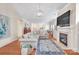 Open living room features a gas fireplace, hardwood floors, and transitional decor at 1006 Phar Lap Dr, Indian Trail, NC 28079