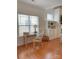 Bright living area with hardwood floors, a desk, large windows, and built in bookshelves at 1006 Phar Lap Dr, Indian Trail, NC 28079