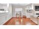 Cozy living room featuring hardwood floors, built-in shelving, and a comfortable seating area at 1006 Phar Lap Dr, Indian Trail, NC 28079