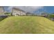 Beautiful green backyard with black metal fencing and manicured lawn at 1048 Harbor Bay Dr, Indian Land, SC 29707
