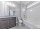 Bathroom features a vanity and a shower-tub combo at 1048 Harbor Bay Dr, Indian Land, SC 29707