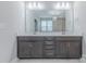 Bathroom features a double sink vanity and a large mirror at 1048 Harbor Bay Dr, Indian Land, SC 29707