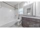 Bathroom features a shower-tub combo and granite-topped vanity with storage at 1048 Harbor Bay Dr, Indian Land, SC 29707