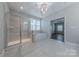 Bright bathroom features glass shower, soaking tub, and tile floor at 1048 Harbor Bay Dr, Indian Land, SC 29707