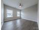 Spacious bedroom with wood-look flooring and plenty of natural light at 1048 Harbor Bay Dr, Indian Land, SC 29707