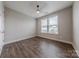 Bedroom with ceiling fan, hardwood floors and natural light at 1048 Harbor Bay Dr, Indian Land, SC 29707