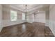 Dining room featuring hardwood floors, wainscoting, and natural light from large windows at 1048 Harbor Bay Dr, Indian Land, SC 29707