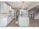 Beautiful kitchen featuring white cabinets, stainless appliances, and center island at 1048 Harbor Bay Dr, Indian Land, SC 29707
