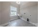 Bright laundry room features tile floors, utility sink, and a window offering a nice view at 1048 Harbor Bay Dr, Indian Land, SC 29707