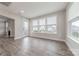 Open living room with fireplace, hardwood floors and access to outside deck at 1048 Harbor Bay Dr, Indian Land, SC 29707