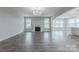 Open living room with fireplace, hardwood floors, and large windows offering natural light at 1048 Harbor Bay Dr, Indian Land, SC 29707