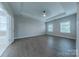 Spacious bedroom features a tray ceiling, recessed lighting, and hardwood floors at 1048 Harbor Bay Dr, Indian Land, SC 29707