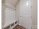 Mudroom with built-in bench, storage cubbies, and hooks for hanging coats at 1048 Harbor Bay Dr, Indian Land, SC 29707