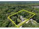 Aerial view of a private estate surrounded by lush trees with yellow boundary lines at 10501 Mount Olive Dr # 7, Mount Pleasant, NC 28124