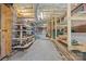 Unfinished basement with open ceiling, concrete floor and wooden shelving at 10501 Mount Olive Dr # 7, Mount Pleasant, NC 28124