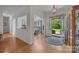 Welcoming foyer with hardwood floors, a decorative rug, and views into the dining room and landscaped outdoors at 10501 Mount Olive Dr # 7, Mount Pleasant, NC 28124