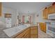 Bright kitchen with a breakfast bar, adjacent to the dining area at 10501 Mount Olive Dr # 7, Mount Pleasant, NC 28124