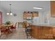 Open kitchen features a breakfast bar, ample cabinet space, and an adjacent dining area at 10501 Mount Olive Dr # 7, Mount Pleasant, NC 28124