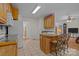 Bright kitchen with a breakfast bar, wood cabinets and tiled floor at 10501 Mount Olive Dr # 7, Mount Pleasant, NC 28124