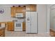 Bright kitchen with oak cabinets and white appliances at 10501 Mount Olive Dr # 7, Mount Pleasant, NC 28124
