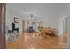 Bright living room featuring a fireplace, hardwood floors, and ample seating, providing a cozy and inviting space at 10501 Mount Olive Dr # 7, Mount Pleasant, NC 28124