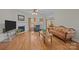 Comfortable living room with hardwood floors, fireplace, and a view into the dining area, perfect for relaxing at 10501 Mount Olive Dr # 7, Mount Pleasant, NC 28124