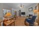 Cozy living room with hardwood floors, fireplace, and traditional furnishings creates a warm atmosphere at 10501 Mount Olive Dr # 7, Mount Pleasant, NC 28124