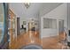 Open-concept living area with hardwood floors, fireplace, and views into the dining room, creating inviting living at 10501 Mount Olive Dr # 7, Mount Pleasant, NC 28124