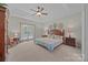 Spacious bedroom with a ceiling fan and bright natural light from the window at 10501 Mount Olive Dr # 7, Mount Pleasant, NC 28124