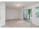 Unfurnished basement with carpet, sliding glass door to walkout patio, and neutral paint at 10548 English Setter Way, Charlotte, NC 28269