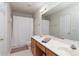 Well-lit bathroom with double vanity, large mirror, and shower with curtain at 10548 English Setter Way, Charlotte, NC 28269