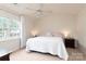 Comfortable bedroom with natural light, ceiling fan, and neutral carpet at 10548 English Setter Way, Charlotte, NC 28269