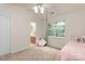 Bright bedroom featuring a hanging chair, pink decor, and natural light at 10548 English Setter Way, Charlotte, NC 28269