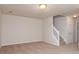 Bedroom offers neutral walls and carpet and is adjacent to a staircase and doorway at 10548 English Setter Way, Charlotte, NC 28269